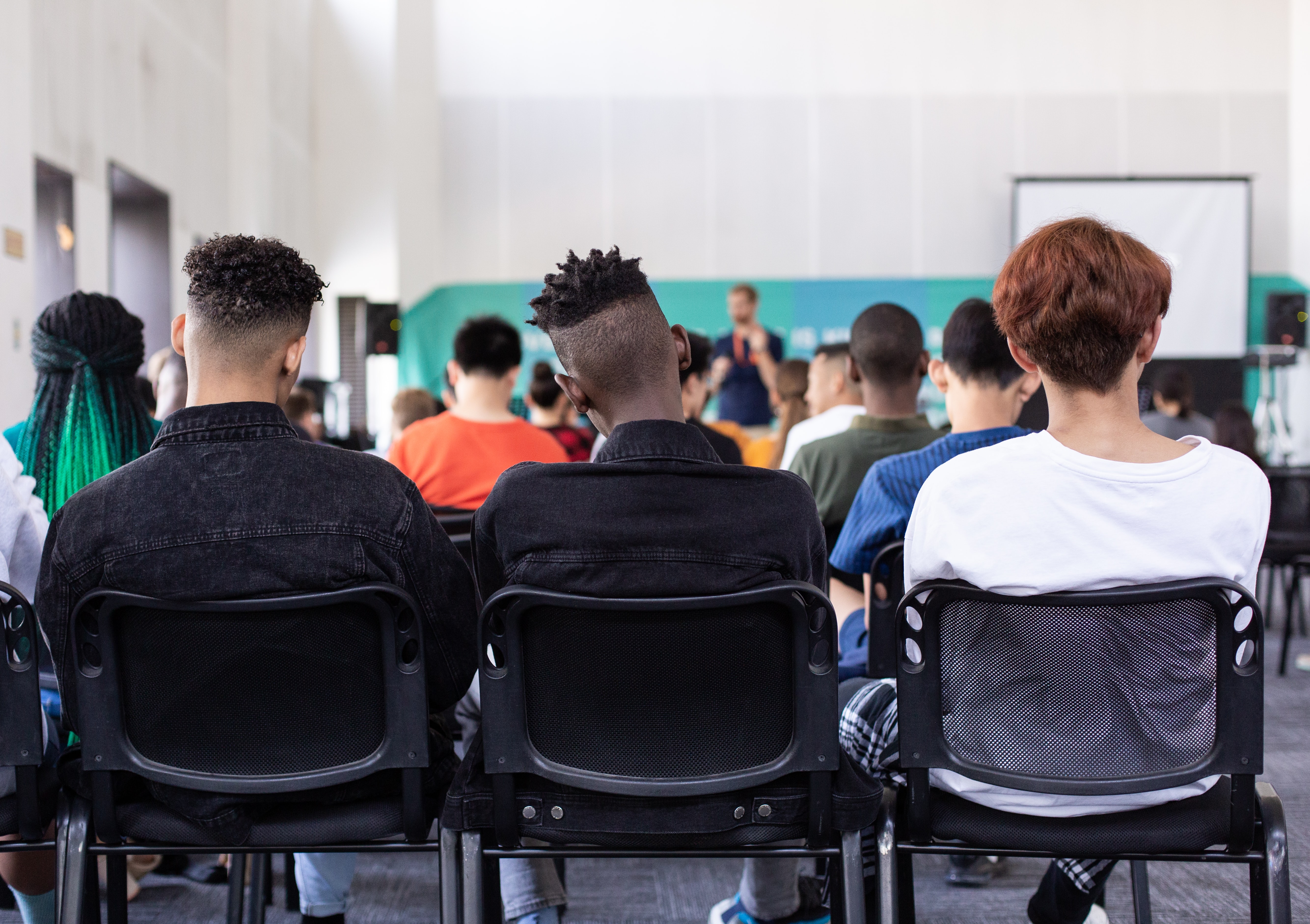 Students in a class room; Credit: @sambalye on Unsplash